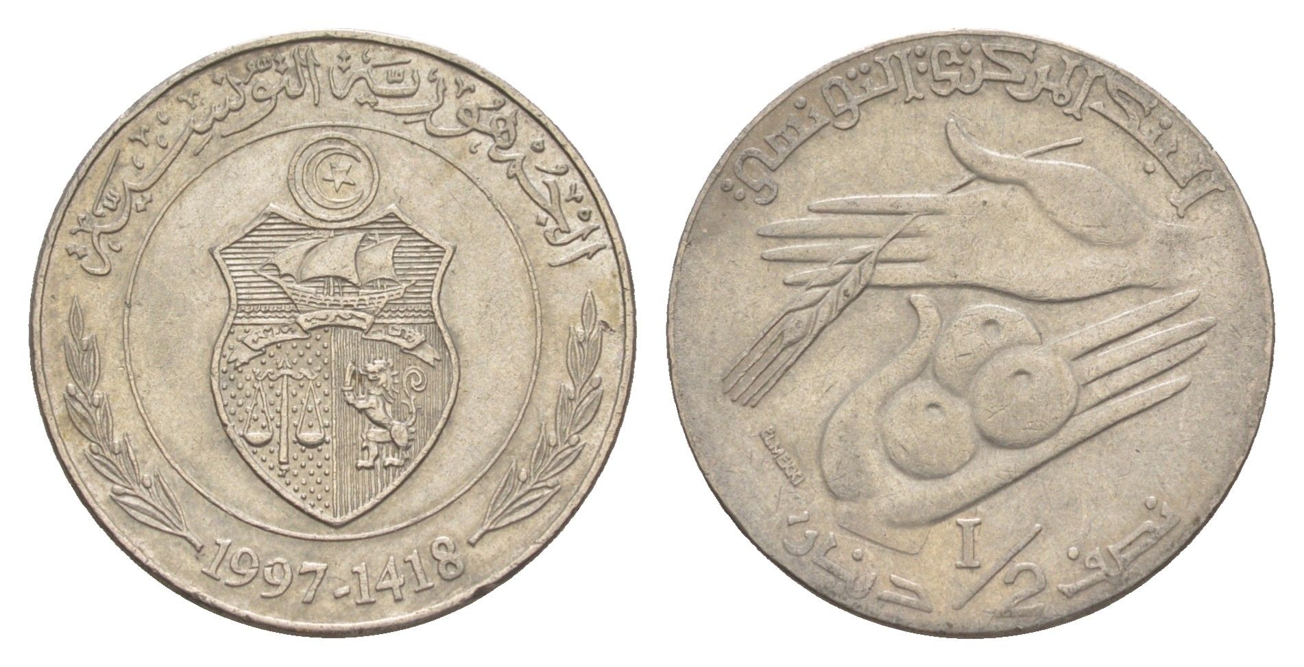 Тунис 1/2 динара 1997 KM 346 медно-никель 4513-312