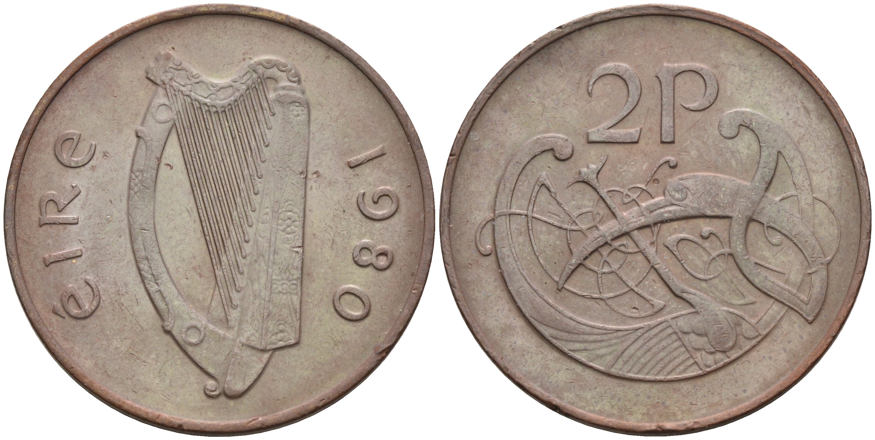 ИРЛАНДИЯ 2 ПЕНСА 1980 ВИНЬЕТКА В ВИДЕ СТИЛИЗОВАННОЙ ПТИЦЫ ИЗ ВТОРОЙ БИБЛИИ КАРЛА II ЛЫСОГО KM 21 бронза 4592-243