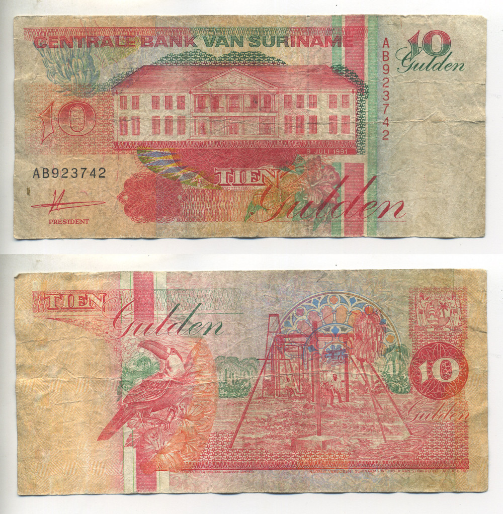СУРИНАМ 10 ГУЛЬДЕНОВ 1991 9 ИЮЛЯ 1991, ЗДАНИЕ ЦЕНТРАЛЬНОГО БАНКА, ТУКАН Pick 137а бумага 7523-36-4