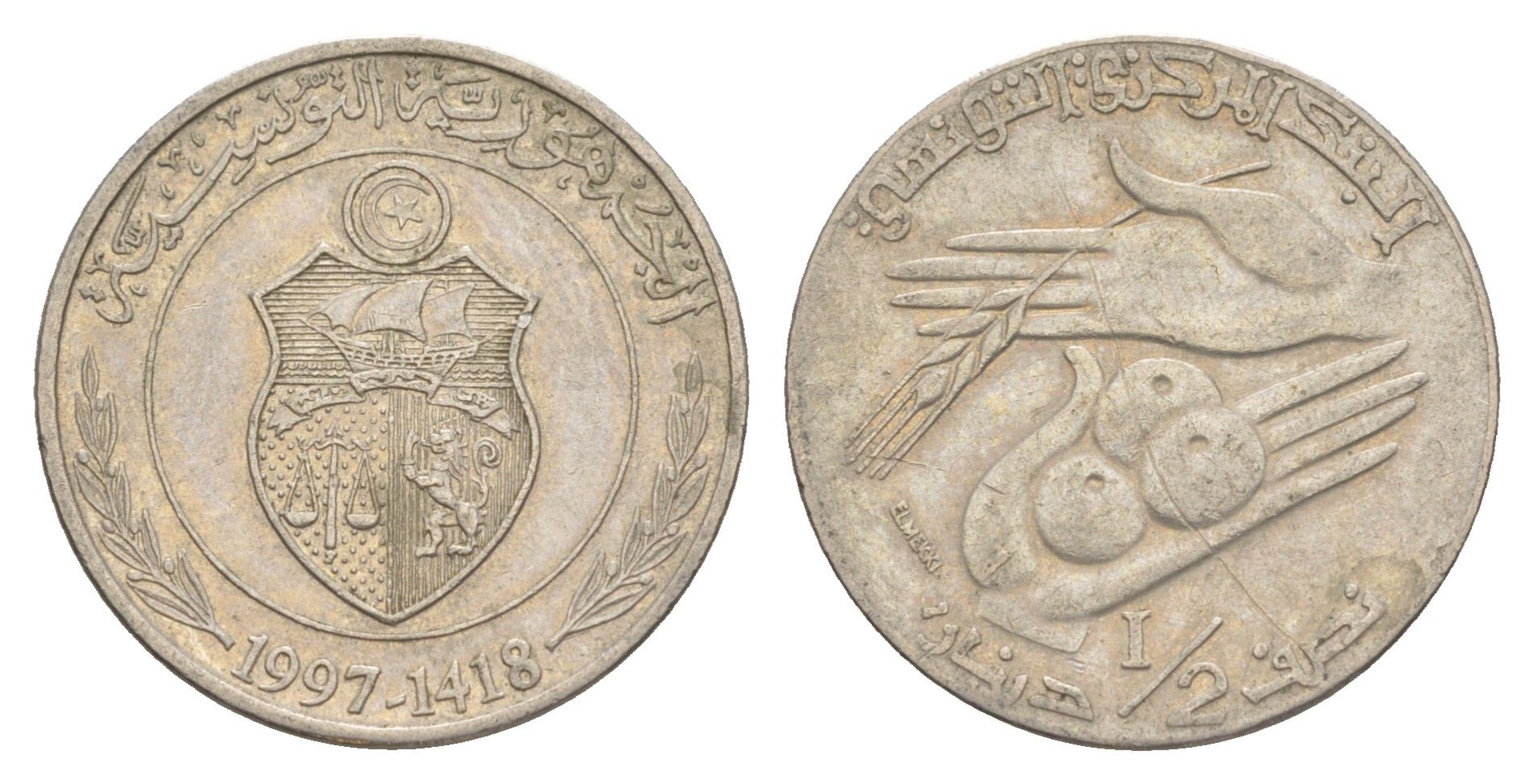 Тунис 1/2 динара 1997 KM 346 медно-никель 4513-311