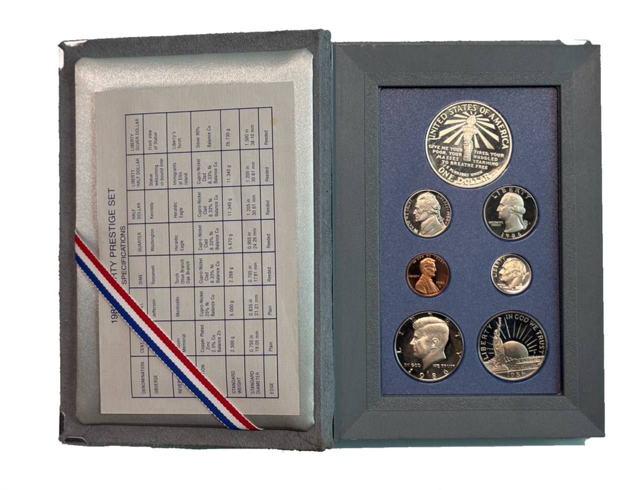 США годовой набор из 7 монет (1, 5, 10 (дайм), 25 (1/4 доллара, квотер) и 50 центов (1/2 доллара); 1 доллар) 1986 100 лет Статуе Свободы, в оригинальной коробке, с сертификатом KM 201b, A192, 195a, 164a, A202b, 212 и 214 PROOF 3-4-10-103